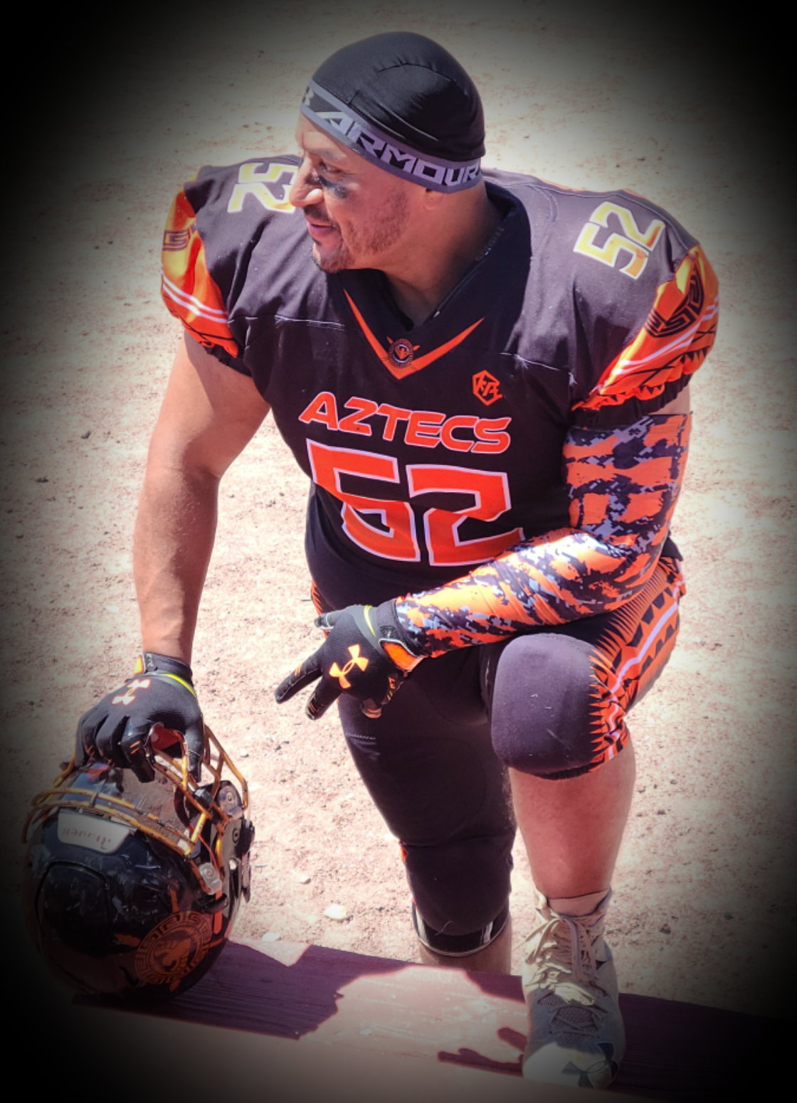 Joe Arredondo, performance and sports coach at Iron Body Fitness, in football uniform